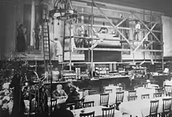 1922 erhielt Arnold Fiechter den Auftrag zu einem Wandgemälde im Bahnhof Basel für das 1. Klasse Bahnhofbuffet in Basel. Dort schuf er die nächsten vier Jahre das hl. (600 cm × 700 cm, 2 × 170 cm × 370 cm). Die Fotografie befindet sich im öffentlich zugänglichen Staatsarchiv Baselland in Liestal, Schweiz.