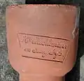 Stempel von Heinrich Aeschlimann auf der Muffe einer gepressten Röhre