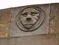 Löwenkopf an der Dachbrüstung