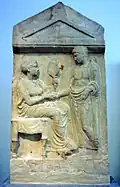 Grabrelief von Mikka und Dion
