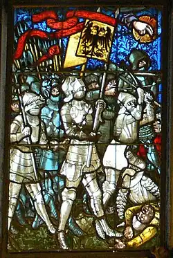 Berner Münster, Chorfenster, zw. 1441 und 1455: Ritterlicher Bannerträger (mit dem roten Wimpel, der sich aus der Kreuzfahrerfahne herleitet)