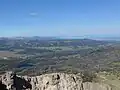 Blick vom Breccia Peak nach Westen, zur Teton Range, Lost Lake im Vordergrund.