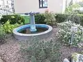 Brunnen vor dem Haus Eiderstraße 4 beim Fruerlundholzer Zentrum