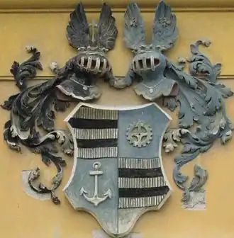 Wappen Alexander von Schoeller an der Fassade von St. Michael, Levice