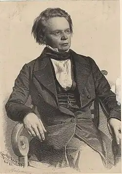 Lithographische Darstellung der Person sitzend von vorne ab Becken aufwärts und leicht rechtsseitige Blickrichtung.