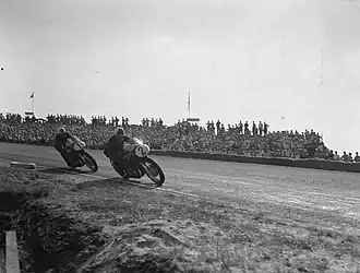 500cc: Reg Armstrong (2), Geoff Duke (1), TT Assen 1955