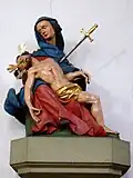 Pieta über dem Eingang der Sakristei