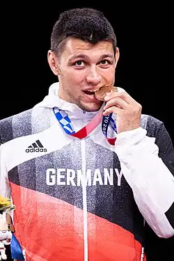 Denis Maksymilian Kudla gewinnt 2021 bei den Olympischen Spielen die Bronzemedaille