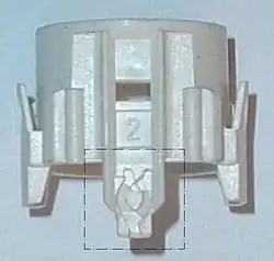Druckschalterteil mit Schaltherz (hervorgehoben durch rechteckiges Einrahmen)