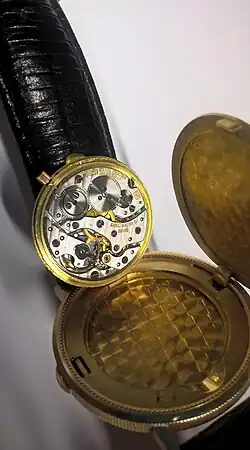 Ebel-Sprungdeckel­armbanduhr (in echt goldener Zwanzig-Dollar-Münze von 1897 der USA)