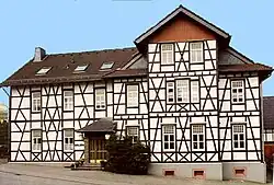 Das Hotel Eifeler Hof ist ein repräsentatives, zweigeschossiges Fachwerkhaus am Eiffelplatz aus dem Jahre 1901 im Stil der Ausflugslokale der Jahrhundertwende erbaut.