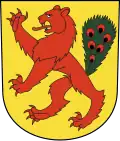 In Gold ein steigender roter Löwe, geschwänzt mit einem grünen Pfauenstoss im Wappen von Fällanden