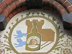Flensburger Wappenvariation zu einer ehemaligen Spirituose aus dem 19. Jahrhundert am Haus Große Straße 36