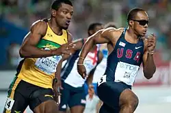 Drittes Halbfinale: Mario Forsythe (li., ausgeschieden), Walter Dix (re., Sieger), im Hintergrund: Christian Malcolm&nbsp;(ausgeschieden)