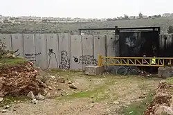 Eine Handala an der Mauer in Niilin, Westjordanland