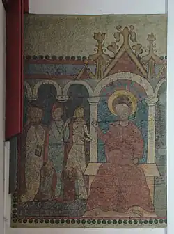 Die Seccomalerei war 1380 gemalt worden und zeigt Christus auf einer Thronbank, wobei Maria Magdalena vor ihm kniet und ihm die Füße wäscht.