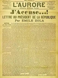 Titelseite der Zeitung L’Aurore mit der Schlagzeile „J’accuse…! Lettre au président de la République par Émile Zola“. Die sechs Spalten gehen über das gesamte Blatt und haben als Untertitel „Lettre à M. Félix Faure“. Rechts oben steht das Datum, der 13. Januar 1898.