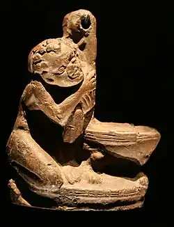 Lampe mit Knaben mit negroiden Zügen.