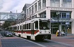 MAX train on Yamhill St with Pioneer Place (1991) – Portland, Oregon