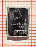 Palladium-Kleinbarren (1&nbsp;Gramm) auf Millimeterpapier