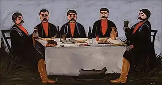 Fünf Männer beim Zechen