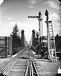 Railway over suspension bridge, 1869