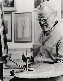 Schwarzweiß-Fotografie: Richard Eberle mit Farbpalette und Staffelei im Atelier 1993