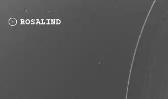 Bild vom Uranusmond Rosalind und einigen Uranusringen