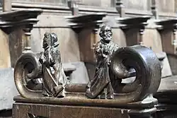 Zwei kniende Personen