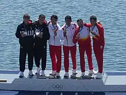 Carlo Tacchini (zweiter von links) bei der Siegerehrung der Olympischen Spiele 2024 in Paris