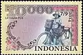Indonesische Briefmarke mit Briefträger auf Postfahrrad von 2014