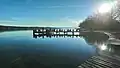 Steg mit Ausflüglern und Alpenblick vom Starnberger Undosa aus