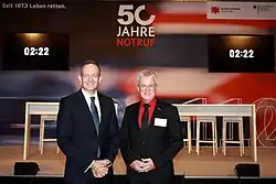 Festakt zu 50 Jahren Notruf 110/112 in Berlin: Volker Wissing, Bundesminister für Digitales und Verkehr, und Pierre-Enric Steiger, Präsident der Björn Steiger Stiftung