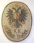 Tabakmuseum in Frastanz, Rathaus – Wandschild: "k. k. Tabak-Trafick" mit Doppeladler.