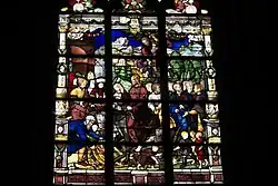 Jesus auf einem Esel reitend wird von den Aposteln und Anhängern umringt.