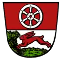 Haßloch (Rüsselsheim am Main): Oben im Wappen das Mainzer Rad, unten ein laufender Hase.