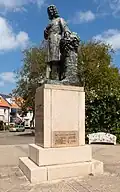 Poeldijk, Statue des Pfarrers Franciscus Verburch entworfen von August Falise