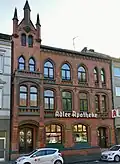 Wohn- und Geschäftshaus mit Adler-Apotheke, Duisburg-Beeck